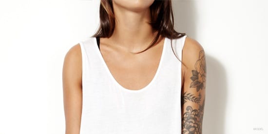 Woman with tattoos on arm