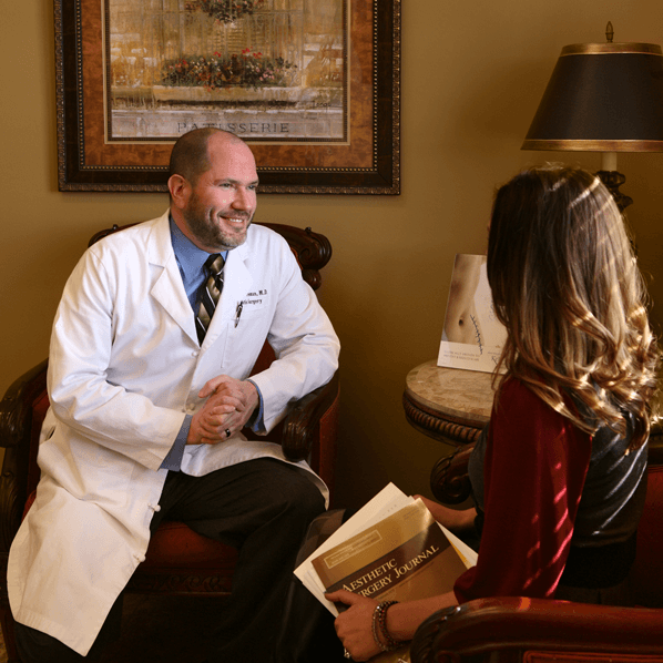 Dr. Freeman consulting with a female patient