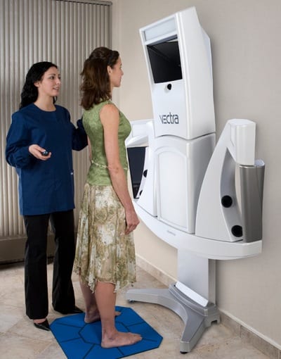 Woman posing for VECTRA imaging camera