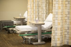 Madison Avenue Surgery Center recovery area, including two beds separated by curtains