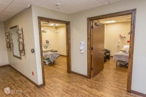 Two Madison Avenue Surgery Center exam rooms containing beds