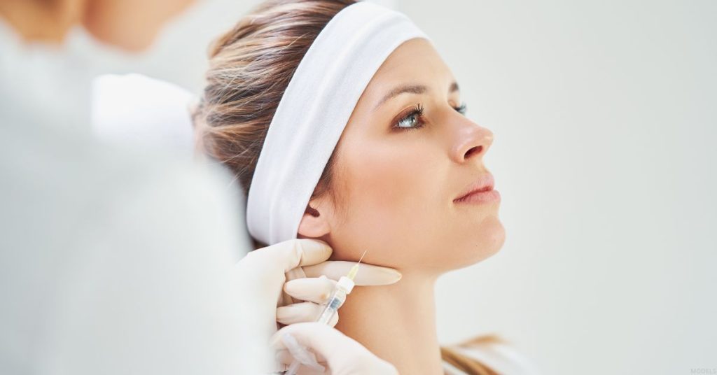 Woman receiving a BOTOX® treatment (models)