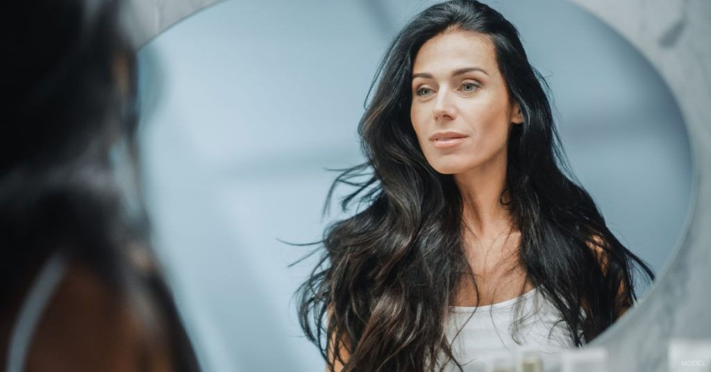 Woman after fillers for smile lines. (Model)